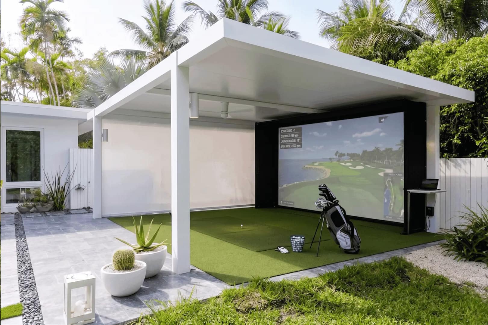 St-Pete-Outdoor-Gazebo-Golf-Simulator-Gulf-of-America - Sims & Greens Luxury backyard gazebo golf simulator in St. Pete, Florida, featuring a weather-protected outdoor hitting bay and premium synthetic turf on the Gulf of America coast.