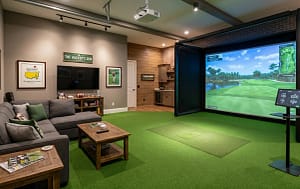 Premium Uneekor Home Golf Simulator Installation | Sims & Greens - Sims & Greens A custom-engineered luxury residential indoor golf simulator sanctuary installation featuring a seamless, flush-mounted synthetic turf flooring that transitions perfectly from the putting mat to the large impact screen, shown in a private home setting.