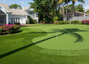 Custom Backyard Putting Green Installation - St. Petersburg, FL - Sims & Greens Custom backyard artificial turf putting green installation with chipping fringe in St. Petersburg, FL