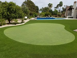Belleair-Florida-Large-Residential-Putting-Green - Sims & Greens Massive custom artificial putting green in Belleair, Florida, featuring multi-hole practice layouts and professional-grade fringe turf.