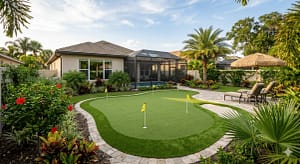Sims & Greens | The Seminole Short-Game Laboratory - Sims & Greens Professional outdoor putting green in Seminole, FL featuring custom-engineered undulations, a deep-sand bunker, and premium multi-directional turf by Sims & Greens.